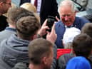 HRH Prince Charles visits the Wm Santus factory in Wigan, makers of the famous Uncle Joe's  Mintballs with John and Anthony Winnard. Children from St Andrew's Primary School wait for the Prince's arrival. Picture by Paul Heyes, Wednesday April 03, 2019.


























