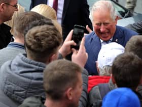 HRH Prince Charles visits the Wm Santus factory in Wigan, makers of the famous Uncle Joe's  Mintballs with John and Anthony Winnard. Children from St Andrew's Primary School wait for the Prince's arrival. Picture by Paul Heyes, Wednesday April 03, 2019.