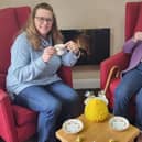 Anne Calland (right) visits B's Cafe at Belong Atherton for a chat with Admiral Nurse, Bridget Lawler (left)