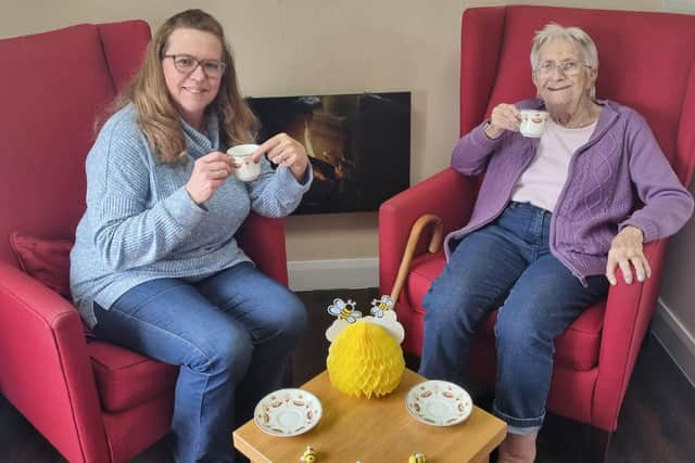 Anne Calland (right) visits B's Cafe at Belong Atherton for a chat with Admiral Nurse, Bridget Lawler (left)