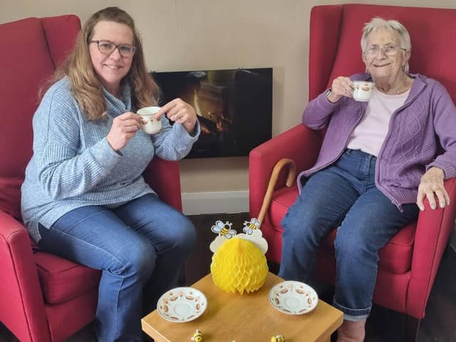 Anne Calland (right) visits B's Cafe at Belong Atherton for a chat with Admiral Nurse, Bridget Lawler (left)