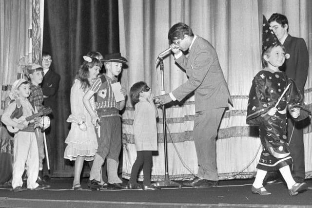 1968 - Cinema manager, Derek Fuller, talks to fancy dress competition entrants at he ABC Minors 21st birthday celebrations in 1968.