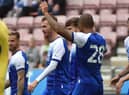 The Latics players celebrate Tom Naylor's goal
