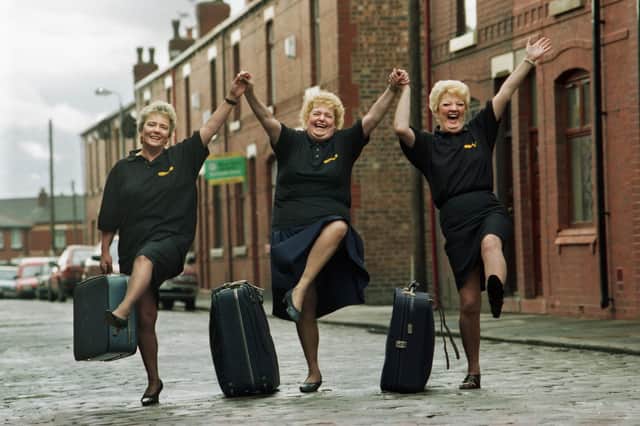 Ince ladies Liz Ramsdale, Enid Keates and Sylvia Armstrong about to take flight from Bird Street on an all-expenses paid trip of a lifetime to Las Vegas with number one chat show hostess Mrs. Merton in March 1997.  They were flying over to the USA, with 50 other regular members of the TV show's audience, to support Mrs. Merton (aka comedienne Caroline Aherne) as she tried to break into the American comedy circuit.