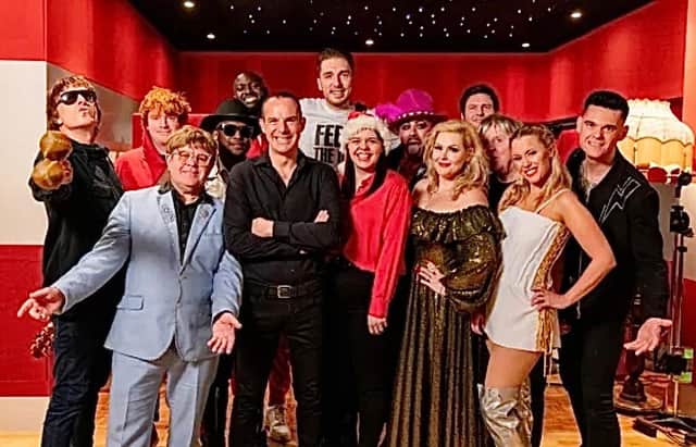 Paul Sutton appears in the video as Boy George, alongside LadBaby, finance expert Martin Lewis and other performers