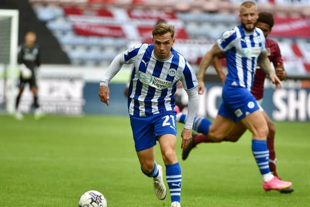 Academy product Scott Smith has signed a contract extension with Latics
