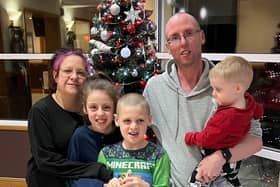 Michael Abram and Stacy Abram with their children Bethany, Jake and Jack at the sanctuary of the Greyhound Hotel in Leigh
