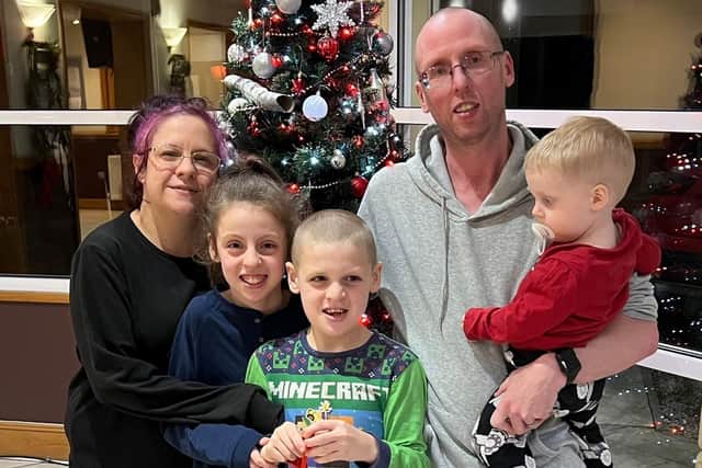 Michael Abram and Stacy Abram with their children Bethany, Jake and Jack at the sanctuary of the Greyhound Hotel in Leigh