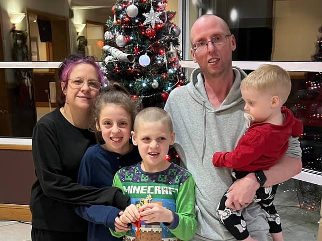 Michael Abram and Stacy Abram with their children Bethany, Jake and Jack at the sanctuary of the Greyhound Hotel in Leigh