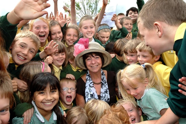 Retiring teacher, Barbara Grimes, is swamped by pupils at St. Bernadettes RC Primary School, Shevington, as she says goodbye after 36 years at the school latterly in the Reception class.