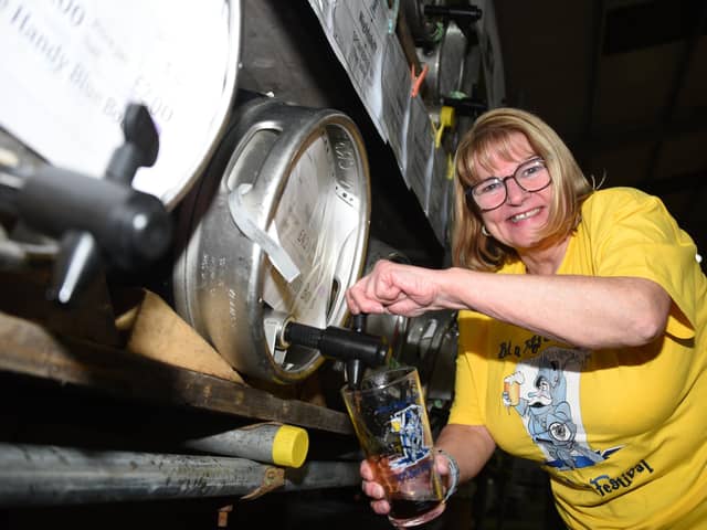 Sandra Cottam serves drinks at last year's festival