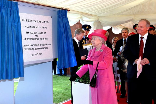The Queen unveils a plaque to commemorate her visit to the Heinz factory on Thursday 21st of May 2009 which was the 50th anniversary of the opening on 21st of May 1959 by the Lord Chancellor, the Rt. Hon. David Maxwell Fyfe.  The Queen Mother visited the factory a few weeks after the opening on the 24th of June.