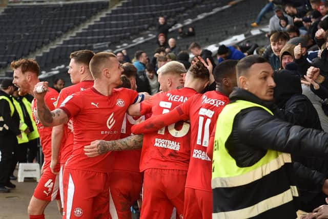 Tom Naylor celebrates his goal at MK Dons