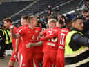 Tom Naylor celebrates his goal at MK Dons