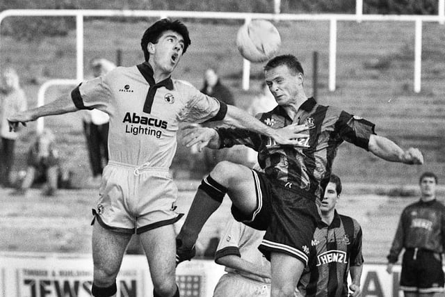 Wigan Athletic winger, Andy Lyons, in a heading duel against Mansfield Town in a Division 3 match at Springfield Park on Saturday 30th of October 1993.
Latics won 4-1 with 2 goals from Pat Gavin and one each from Keith Gillespie and Neil Morton.