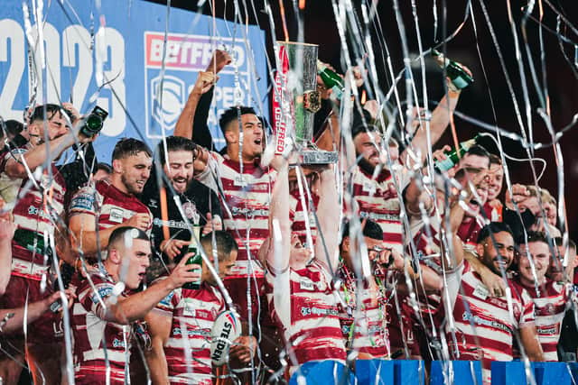 Wigan captain Liam Farrell and team-mates celebrate with the Super League trophy