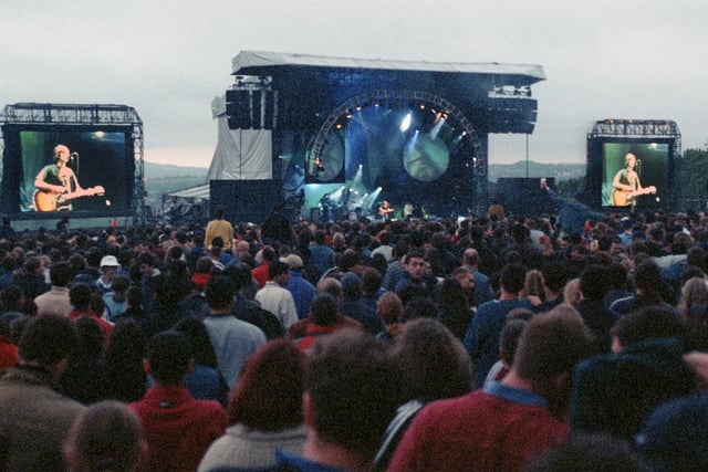 Large screens help those at the back of the crowd see The Verve on stage at Haigh Country Park in front of over 30,000 fans on Sunday May 24 1998.