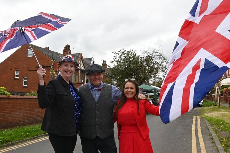 Caroline George, Michael Prescott and Amanda Prescott enjoy their street party on Gidlow Avenue, Wigan