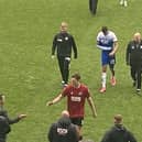 Ashley Fletcher leaves the field for the last time as a Latics player, after breaking his arm against Millwall