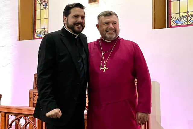 Rev Christopher Hughes (left) with Bishop Steven Evans after presenting him with the cross from His Holiness The Pope
