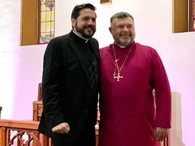 Rev Christopher Hughes (left) with Bishop Steven Evans after presenting him with the cross from His Holiness The Pope