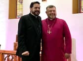 Rev Christopher Hughes (left) with Bishop Steven Evans after presenting him with the cross from His Holiness The Pope