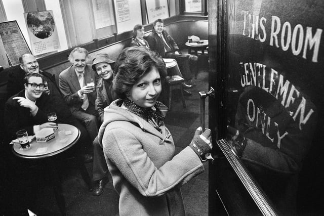 Student Marilyn Evans enters the gentlemen only bar in the Market Hotel, Mesnes Street, Wigan, on Monday 29th of December 1975, the first day of the new equality act for women.  For 50 years men only had crossed the threshold of the exclusively male only bar in the Wigan pub but the Sex Discrimination Act changed all that.