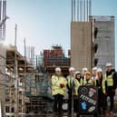 Fettlers project team at the location of the Hampton by Hilton Wigan. Left to right: Andrew Ward, operations director, Galliford Try; Paul Blackmore, vice-president, development, UK and Ireland, Hilton; Sarah Beth Riley, service manager for commercial developments, Wigan Council; council leader David Molyneux, council finance director Sarah Johnston, Cityheart development director Darren Jones, council chief executive Alison McKenzie-Folan and Richard Farrar, founder and MD of Leaf