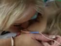 Hollie Dance with her son Archie Battersbee in hospital