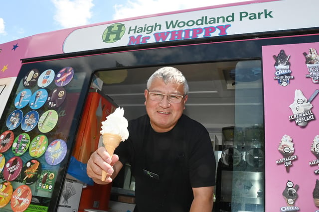 Steven Shing from CJ Ice Creams, offers a cooling treat to visitors at Haigh Woodland Park.