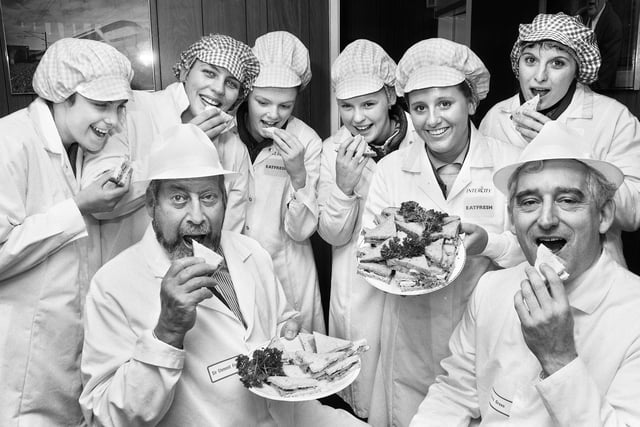 Well known politician, writer and radio and television personality, Clement Freud, and Managing Director of Inter City rail, Chris Green, sample the products with staff after officially opening the Eatfresh Inter City sandwich shop factory in Cross Street, Wigan, on Tuesday 12th of May 1992.