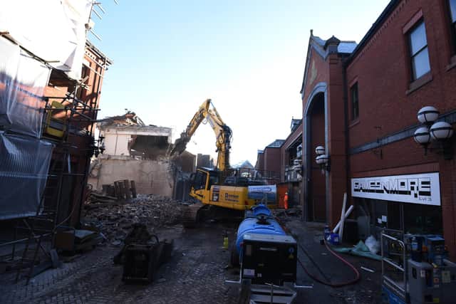 A digger at work on the Galleries demolition. The former Games 'n' More store can be seen in the foreground