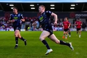 Zach Eckersley breaks through to score a try for Wigan Warriors