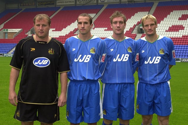 WIGAN ATHLETIC AFC 2004-2005 - Latics manager Paul Jewell, sporting the new black away kit, with his new signings David Wright, David Graham and Per Frandsen.
