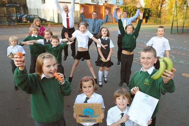 Woodfield Primary School School Council celebrate achieving Healthy School status with head teacher Julie Charnley, Pete Coulson, from the council's Children and Young People's Services, David Layland, chair of governors, and school inspector Jim Kidd.