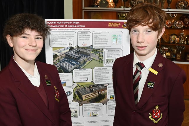 Pupils take a look at the plans and designs for their new school.
