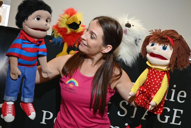 Lisa Lundie of Next STAGE Performing Arts with some of her puppet for Let's Pretend.