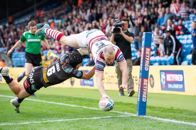 Liam Marshall dives over for the opening try of the game.