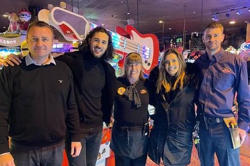 Kym Marsh and Graziano Di Prima having fun at Coral Island on Blackpool promenade , with members of staff.