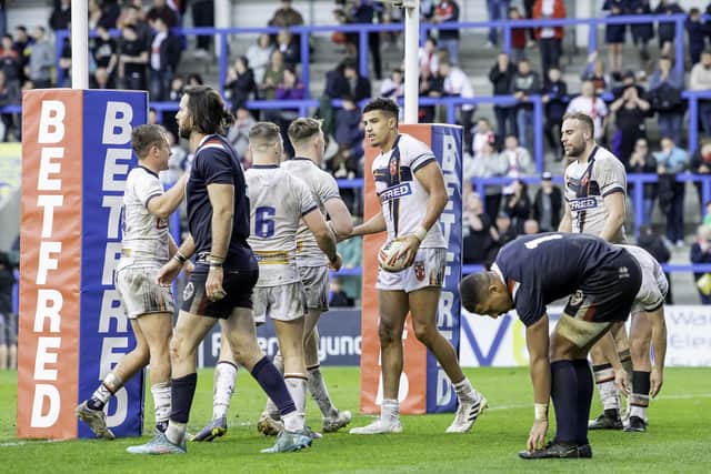Kai Pearce-Paul is congratulated on his try against France