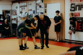Local wrestling coach Roy Wood is among the Wiganers celebrated by the King in the New Year honours list