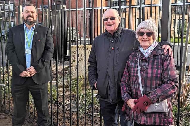 Councillor Lee Robert McStein, local historian Michael Caine and Avis Freeman, from Leigh Soroptimists, with the boundary stone