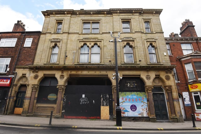 Empty building on King Street, Wigan - signs for Maloneys and Dawsons Music shop