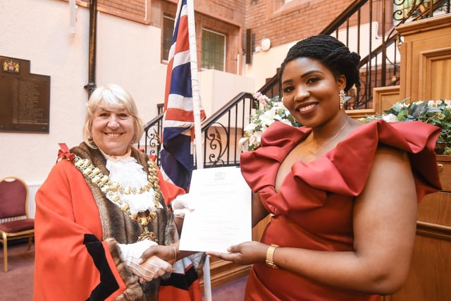Wigan's newest British citizens are celebrated as the Mayor of Wigan Coun Marie Morgan presents certificates and poses for photographs with recipients at the Wigan British Citizenship ceremony at Wigan Town Hall.