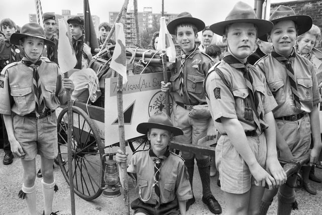 Members of the 7th Wigan All Saints Scouts dressed in the uniform from an earlier era to celebrate the 75th anniversary of the scout movement at the St. George's Day parade on Sunday 24th of April 1983.