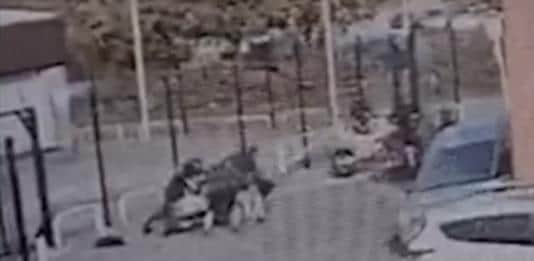The biker and his vehicle are dragged to the ground