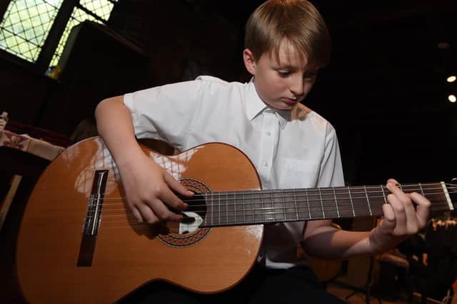 Jack Barber, then 12, playing the guitar at the 2021 Wigan Young Musician of the Year final held at St Wilfrid's Parish Church, Standish