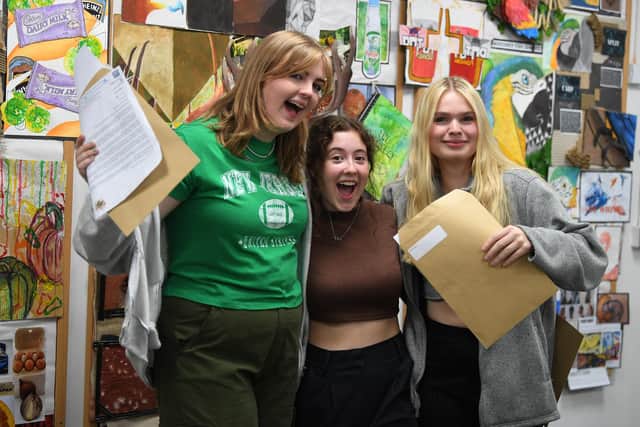 GCSE results day at Shevington High School. Year 11 pupils, Lizzie Stewart, Hannah Stalker and Sienna Baines.