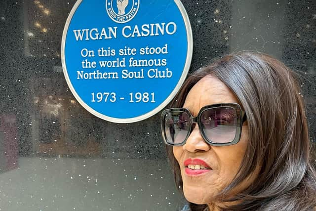 Gloria Jones at the blue plaque to the Wigan Casino site at Grand Arcades