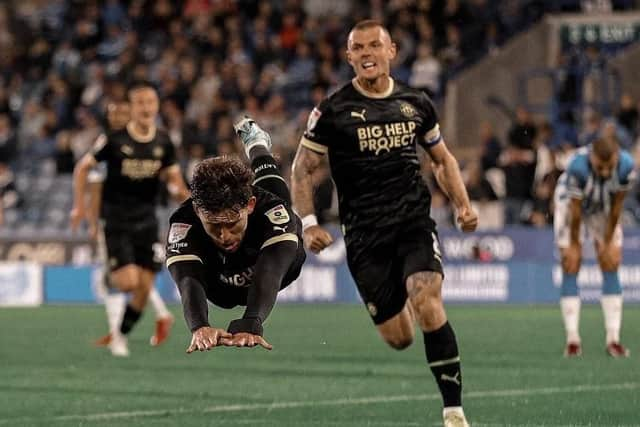 Callum Lang celebrates his late winning goal at Huddersfield